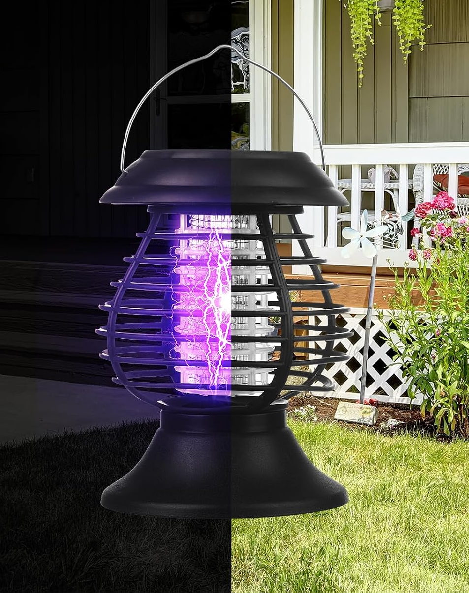 Solar bug zapper hanging in a garden setting