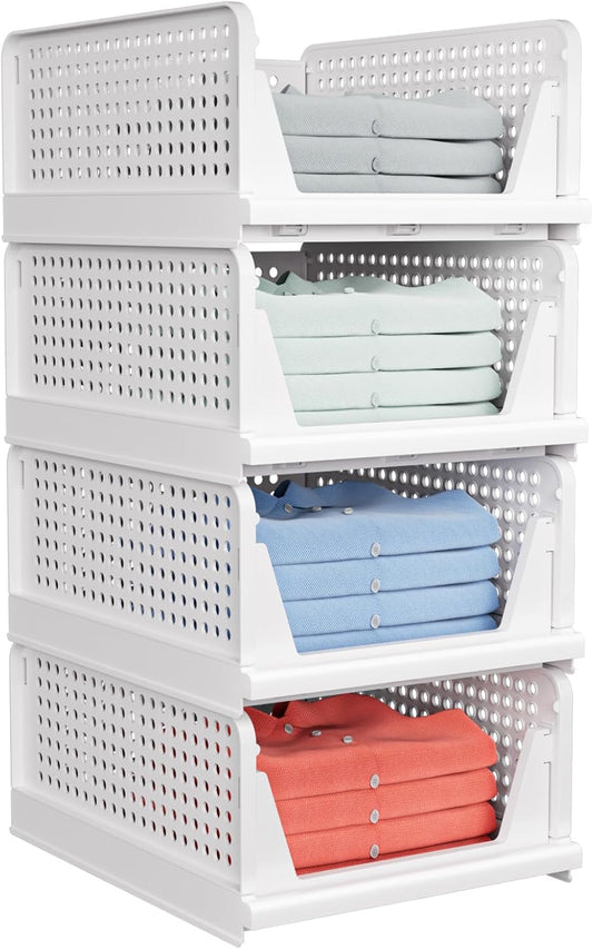 White storage basket with colorful folded clothes on a white background