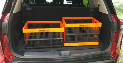Two orange and black collapsible storage crates set up open in the trunk of an SUV.