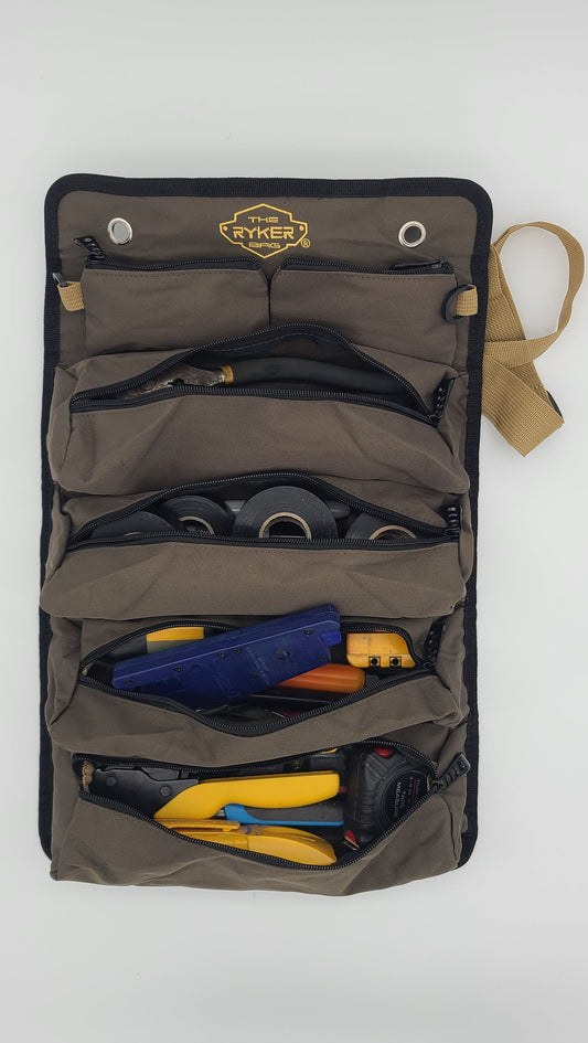 Original roll-up tool bag open and filled with tools.