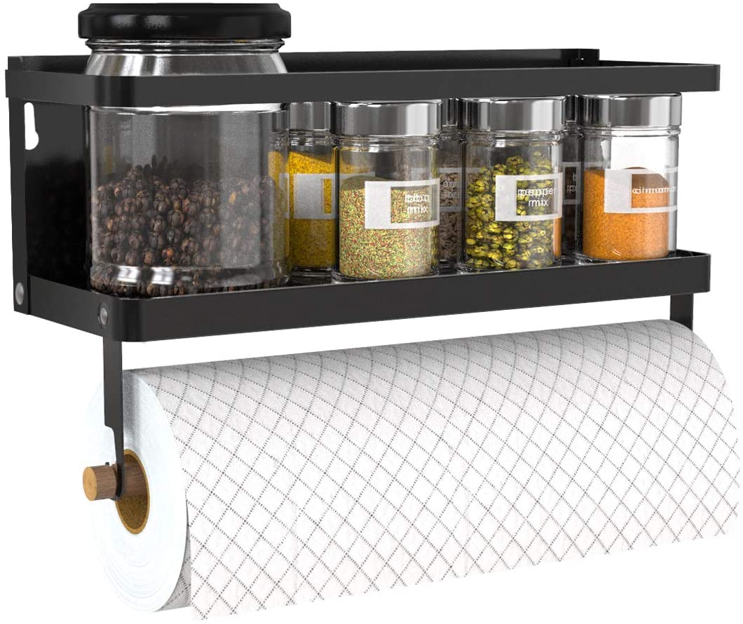Spice rack with transparent jars containing various spices on a white tiled wall.